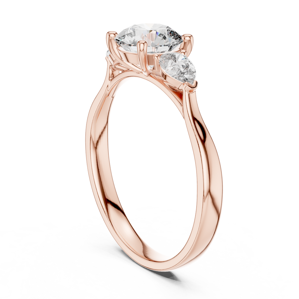 Round and Pear Diamond Three Stone Ring