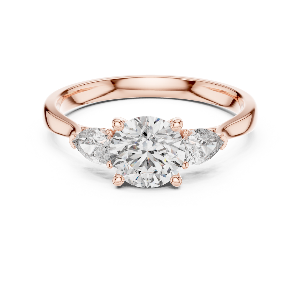 Round and Pear Diamond Three Stone Ring