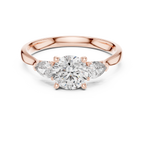 Round and Pear Diamond Three Stone Ring