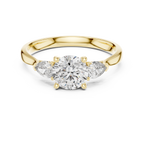 Round and Pear Diamond Three Stone Ring