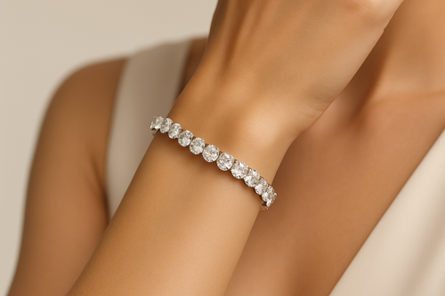 Close-up of a model wrist elegantly posed, wearing a lab-grown diamond bracelet/bangle. Jewelry should appear crisp, reflective, and eye-catching. Background soft neutral with a premium touch — minimal, modern, and luxury-inspired, keeping jewelry as the hero.
