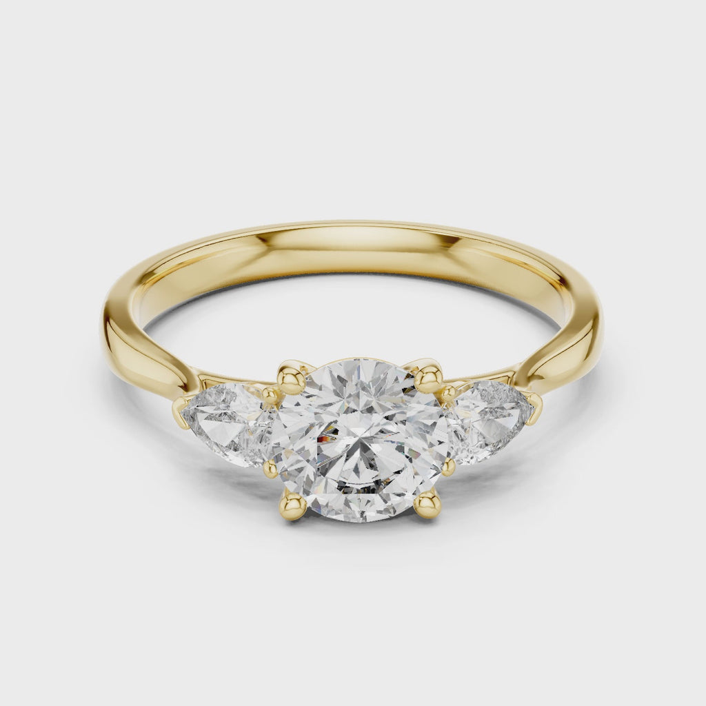 Round and Pear Diamond Three Stone Ring