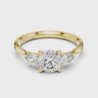 Round and Pear Diamond Three Stone Ring